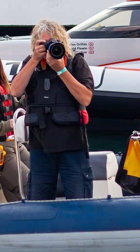 Andy Blondell taking photos from a boat